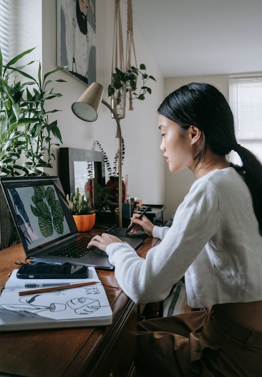 Person working on a laptop at a desk — micro-task platforms let you earn from any device with a browser
